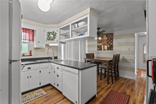 237 Creston, West Mifflin, PA 15122 - kitchen with white appliances, dark countertops, white cabinetry, wood finished floors, and a ceiling fan