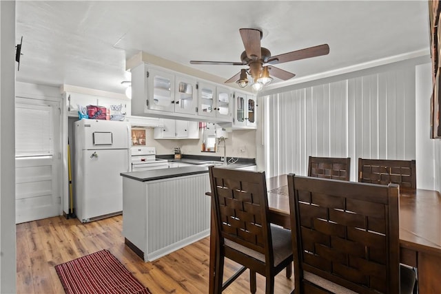 237 Creston, West Mifflin, PA 15122 - kitchen with white appliances, a ceiling fan, dark countertops, ventilation hood, and white cabinetry