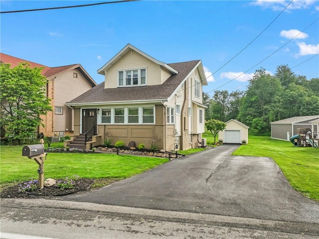 2026 Darlington Rd, Chippewa Twp, PA 15010 - traditional-style house featuring a garage, an outdoor structure, roof with shingles, and a front lawn