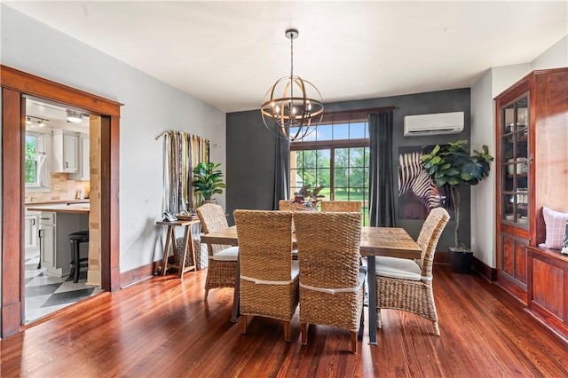2026 Darlington Rd, Chippewa Twp, PA 15010 - dining area with dark wood finished floors, a wall mounted air conditioner, a chandelier, and healthy amount of natural light