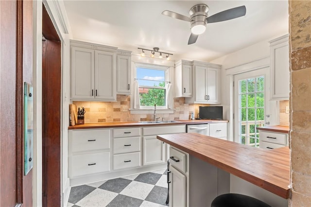 2026 Darlington Rd, Chippewa Twp, PA 15010 - kitchen with wooden counters, light floors, backsplash, a ceiling fan, and healthy amount of natural light