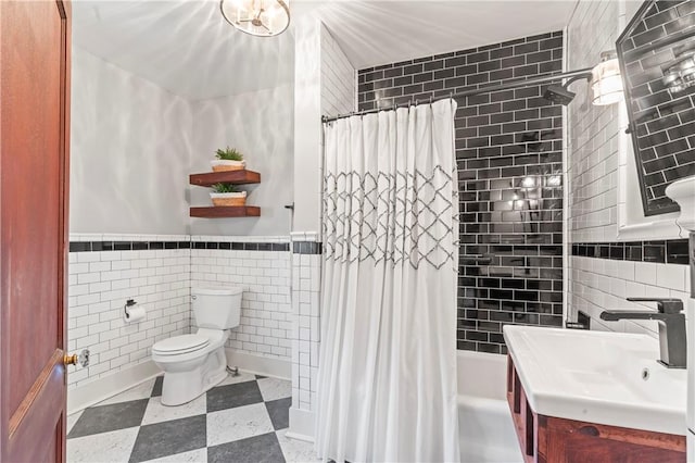 2026 Darlington Rd, Chippewa Twp, PA 15010 - full bath with tile walls, tile patterned floors, shower / bath combination with curtain, vanity, and wainscoting