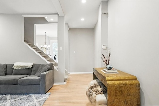 5727 Kentucky Ave, Shadyside, PA 15232 - living room featuring light wood-type flooring, recessed lighting, a chandelier, and stairway