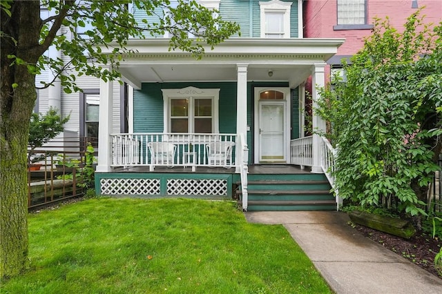 5727 Kentucky Ave, Shadyside, PA 15232 - view of exterior entry featuring a porch and a lawn