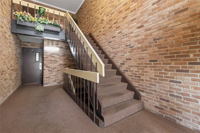 604 Calais Dr Unit 1203, Mccandless, PA 15237 - staircase featuring brick wall, carpet flooring, and a high ceiling