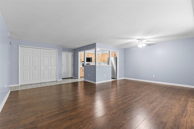 604 Calais Dr Unit 1203, Mccandless, PA 15237 - unfurnished living room featuring a ceiling fan and wood finished floors