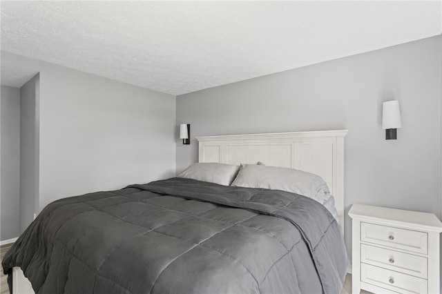 6013 Patrick Henry, Hopewell Twp Bea, PA 15001 - bedroom with light wood-type flooring and a textured ceiling