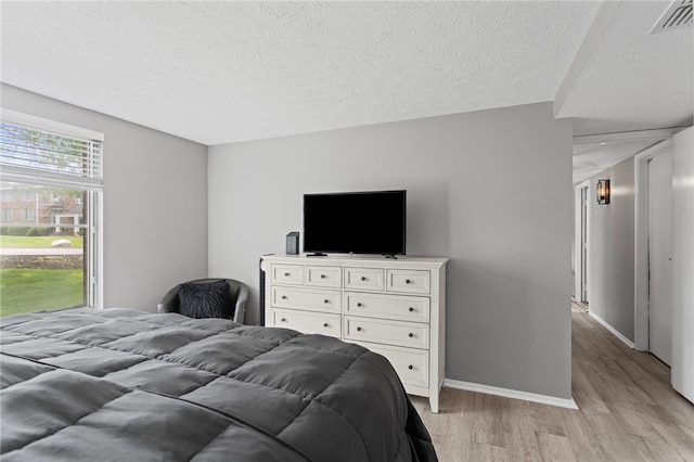 6013 Patrick Henry, Hopewell Twp Bea, PA 15001 - bedroom featuring light wood-style floors and a textured ceiling