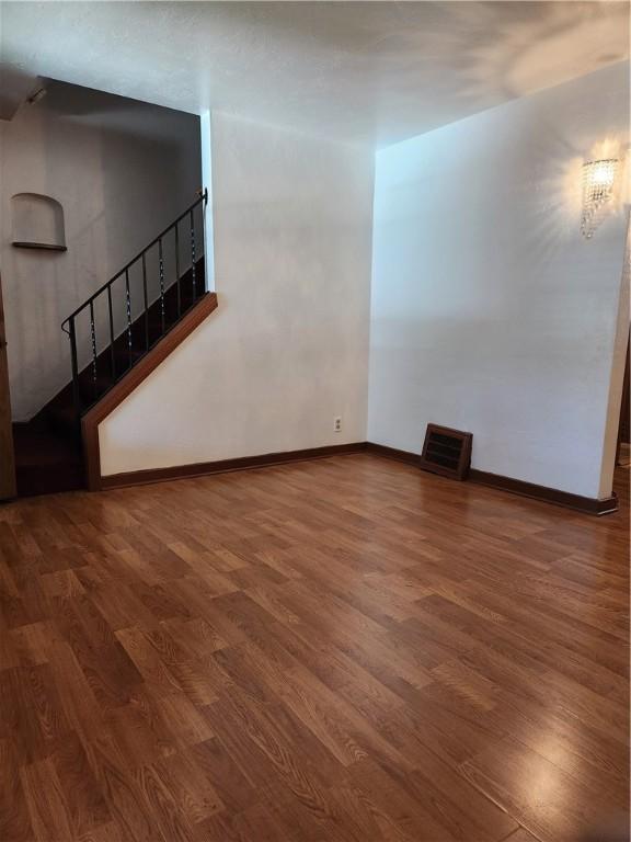 820 Shawnee, Schenley Heights, PA 15219 - unfurnished room featuring wood finished floors and stairway