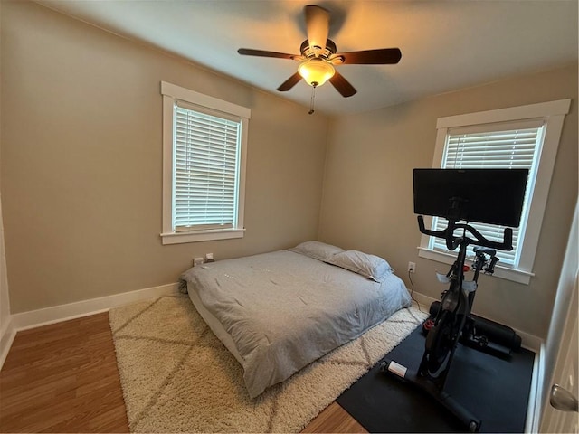 341 Deer Creek Rd, Clinton Twp, PA 16056 - bedroom with multiple windows, wood finished floors, and ceiling fan