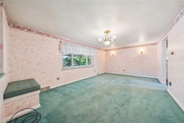 11 Frick Ave, Irwin, PA 15642 - empty room with wallpapered walls, a chandelier, and carpet floors