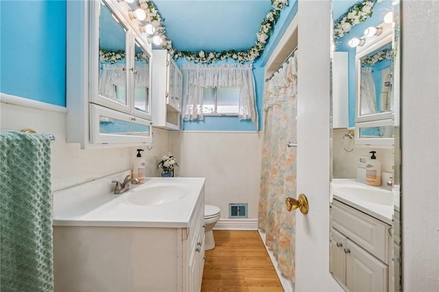 11 Frick Ave, Irwin, PA 15642 - full bathroom featuring vanity, wood finished floors, and curtained shower