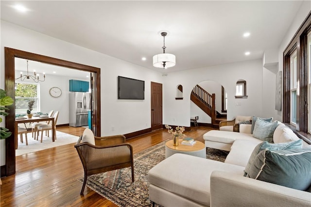 1738 Barr Ave, Crafton, PA 15205 - living area with arched walkways, a chandelier, wood finished floors, and recessed lighting
