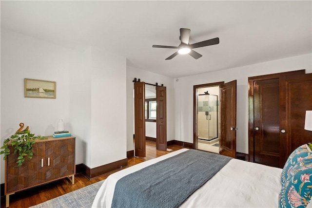 1738 Barr Ave, Crafton, PA 15205 - bedroom with a barn door, wood finished floors, and a ceiling fan