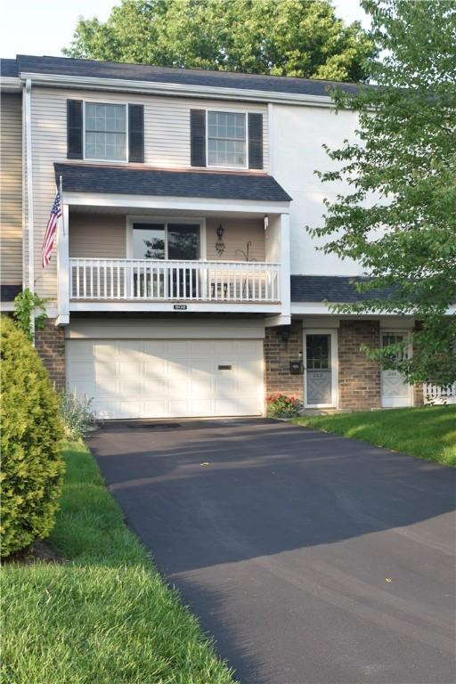 202 Roscommon Pl, Peters Twp, PA 15317 - view of front facade with a garage, asphalt driveway, and a balcony