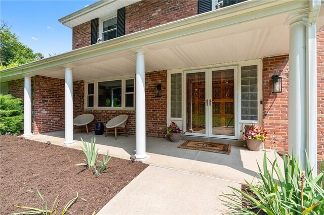 4077 Clarkland Ave, Hampton, PA 15101 - doorway to property featuring a porch and brick siding