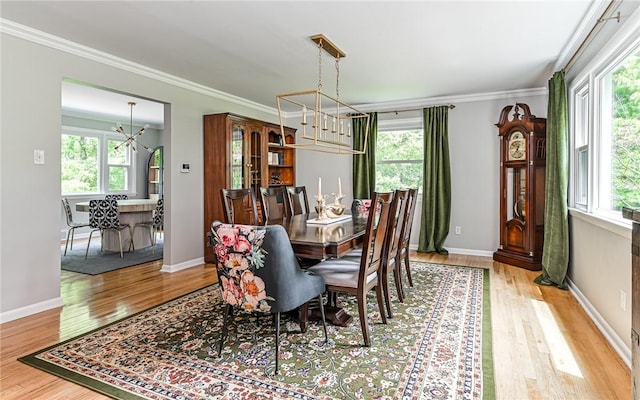 4077 Clarkland Ave, Hampton, PA 15101 - dining area with a chandelier, plenty of natural light, wood finished floors, and ornamental molding