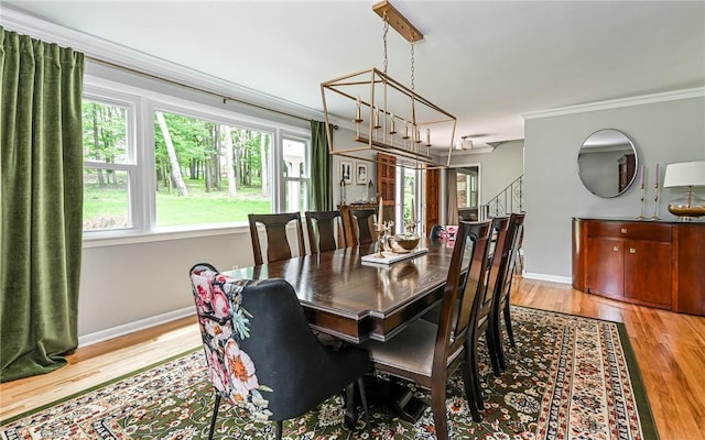 4077 Clarkland Ave, Hampton, PA 15101 - dining area with ornamental molding, wood finished floors, and stairway