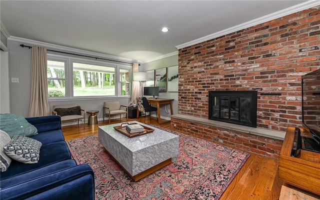 4077 Clarkland Ave, Hampton, PA 15101 - living area featuring crown molding, a brick fireplace, wood finished floors, and recessed lighting