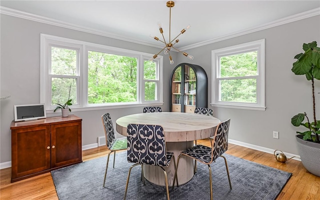4077 Clarkland Ave, Hampton, PA 15101 - dining space with a chandelier, crown molding, and light wood-style flooring