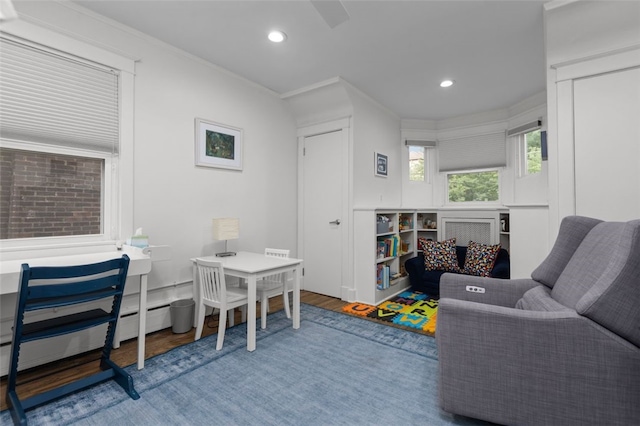 5508 Darlington Rd, Squirrel Hill, PA 15217 - living area with wood finished floors, recessed lighting, and a baseboard heating unit