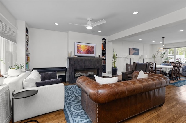 5508 Darlington Rd, Squirrel Hill, PA 15217 - living room with wood finished floors, recessed lighting, a ceiling fan, and a tile fireplace