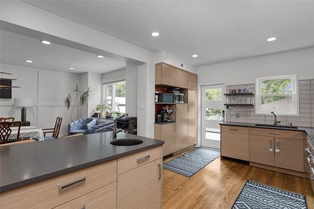 5508 Darlington Rd, Squirrel Hill, PA 15217 - kitchen with dark countertops, open shelves, light wood finished floors, tasteful backsplash, and recessed lighting