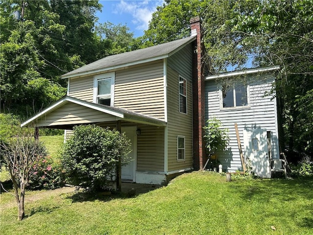 19 Wickhaven Hollow Rd, Perry Twp Fay, PA 15492 - view of property exterior with a chimney and a lawn