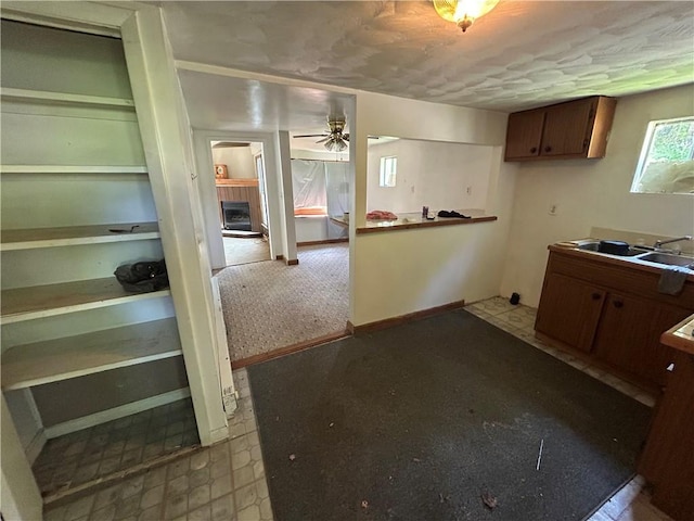 19 Wickhaven Hollow Rd, Perry Twp Fay, PA 15492 - kitchen featuring a fireplace and a ceiling fan