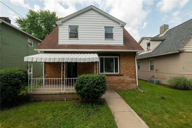 347 Washington St, Leetsdale, PA 15056 - view of front facade featuring brick siding, a front lawn, and covered porch