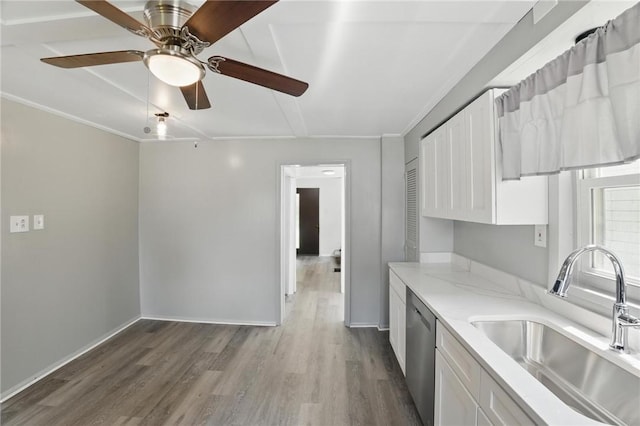 347 Washington St, Leetsdale, PA 15056 - kitchen with dishwasher, white cabinetry, wood finished floors, a ceiling fan, and ornamental molding