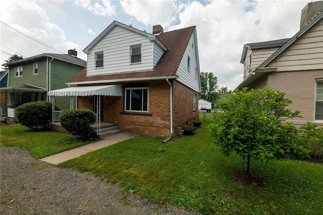 347 Washington St, Leetsdale, PA 15056 - bungalow-style house featuring brick siding, a front yard, and a chimney