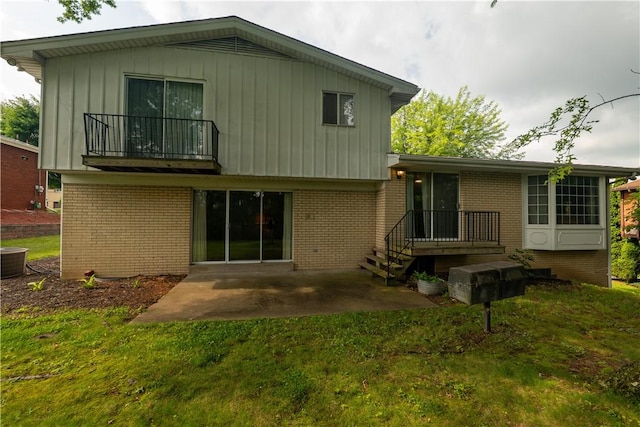 480 Herbst Manor Rd, Kennedy Twp, PA 15108 - rear view of property with brick siding, a yard, a balcony, and a patio