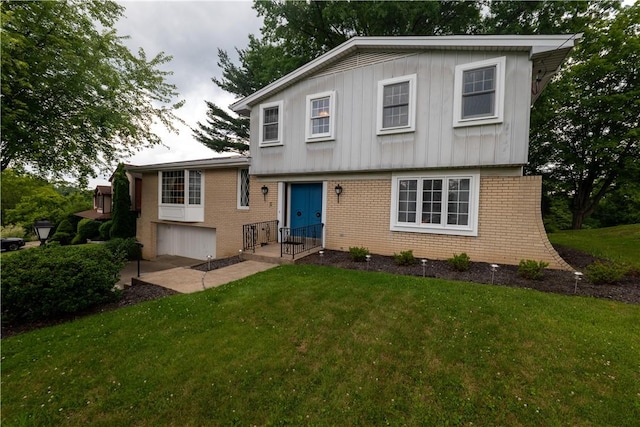 480 Herbst Manor Rd, Kennedy Twp, PA 15108 - split level home featuring brick siding, a front lawn, and board and batten siding
