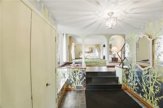 480 Herbst Manor Rd, Kennedy Twp, PA 15108 - foyer featuring wallpapered walls, arched walkways, and a chandelier