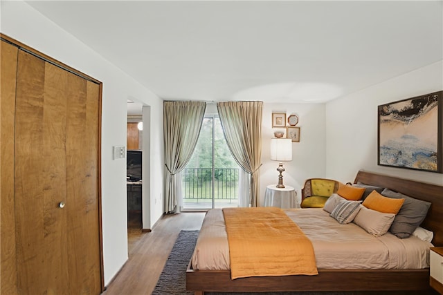 480 Herbst Manor Rd, Kennedy Twp, PA 15108 - bedroom with access to outside and wood finished floors