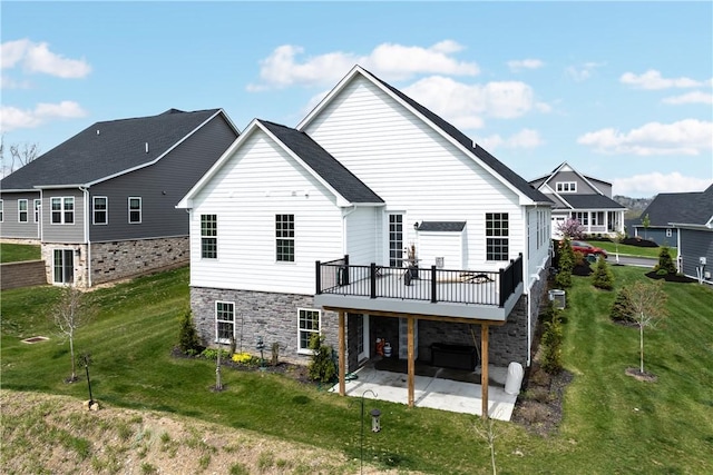 159 Heather Dr, North Strabane, PA 15317 - back of property with a patio, stone siding, a yard, and a deck