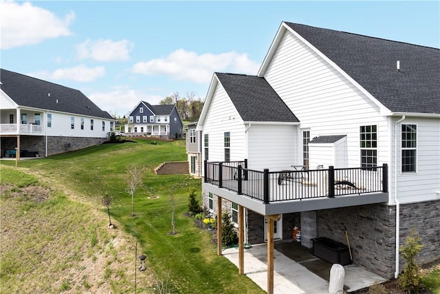 159 Heather Dr, North Strabane, PA 15317 - back of property featuring a lawn, stone siding, a patio area, and a residential view