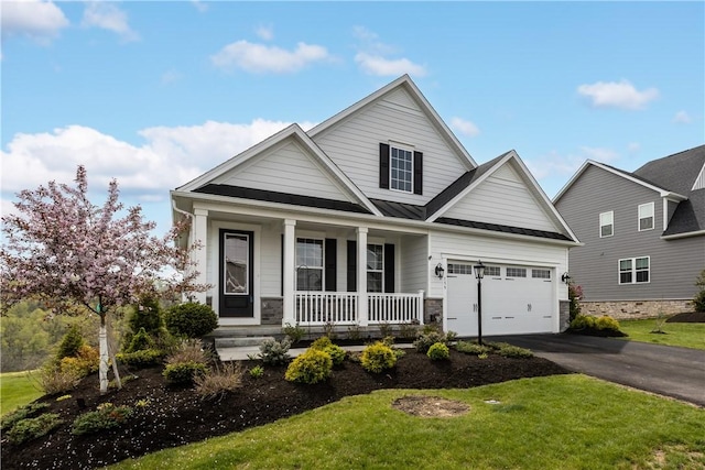 159 Heather Dr, North Strabane, PA 15317 - view of front facade featuring a porch, driveway, a standing seam roof, a front lawn, and stone siding