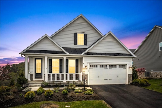 159 Heather Dr, North Strabane, PA 15317 - view of front of home featuring a porch, a standing seam roof, asphalt driveway, and an attached garage