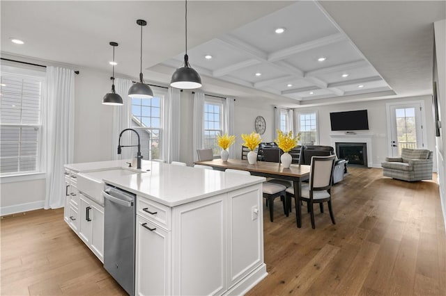 159 Heather Dr, North Strabane, PA 15317 - kitchen with stainless steel dishwasher, coffered ceiling, light wood-style floors, white cabinets, and a center island with sink