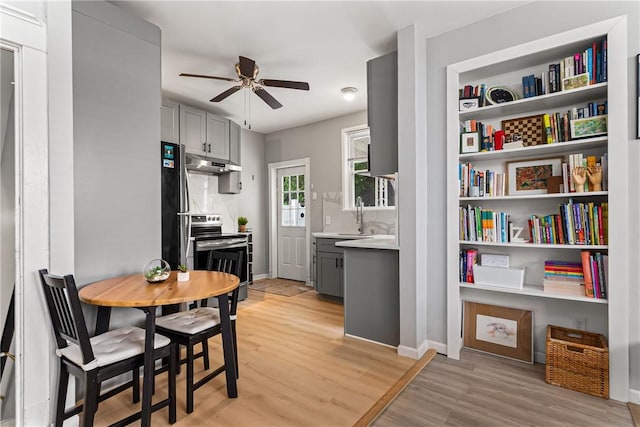 5719 Hobart St, Squirrel Hill, PA 15217 - dining space featuring a ceiling fan and light wood-style flooring