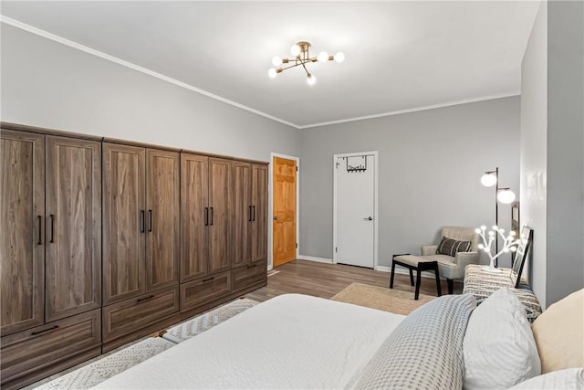5719 Hobart St, Squirrel Hill, PA 15217 - bedroom with a chandelier, wood finished floors, and ornamental molding