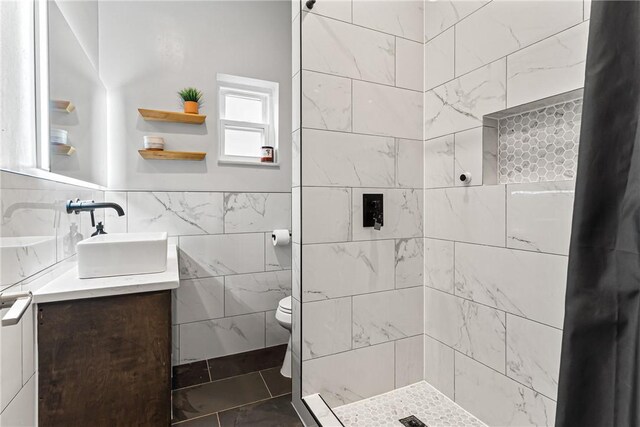 5719 Hobart St, Squirrel Hill, PA 15217 - full bath with vanity, a tile shower, and tile walls