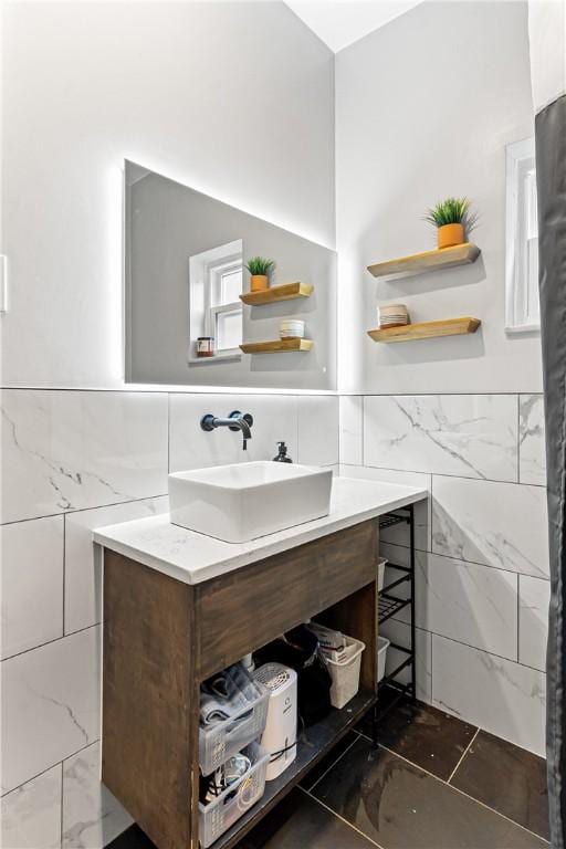 5719 Hobart St, Squirrel Hill, PA 15217 - bathroom with tile walls, vanity, and wainscoting