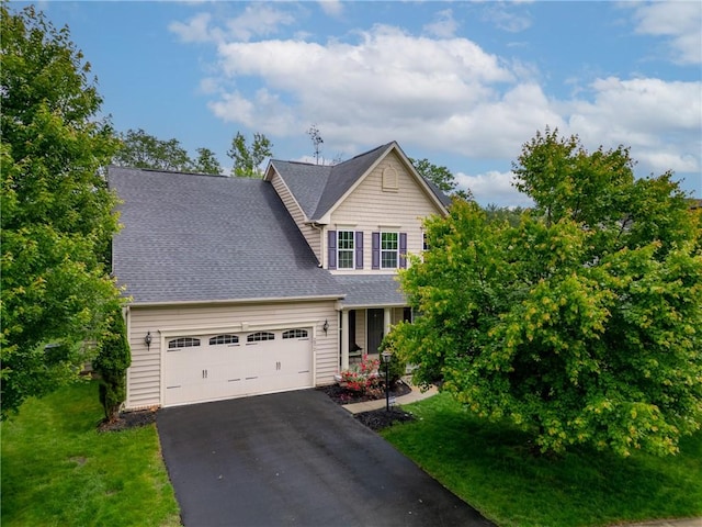 2972 Cross Creek Ct, Hampton, PA 15044 - view of front of house with asphalt driveway, a garage, a front yard, and a shingled roof