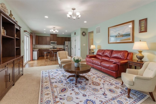 2972 Cross Creek Ct, Hampton, PA 15044 - living room with a chandelier, recessed lighting, and light carpet