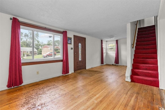 2519 Sylvania Dr, Bethel Park, PA 15102 - foyer entrance featuring a textured ceiling, light wood finished floors, and stairway