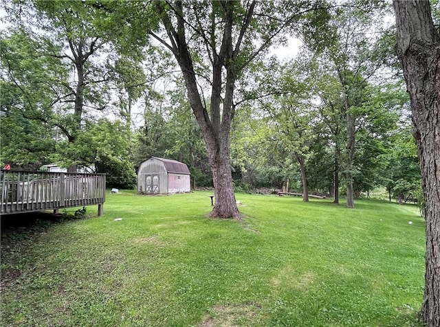 2519 Sylvania Dr, Bethel Park, PA 15102 - view of green lawn featuring a wooden deck and a storage unit
