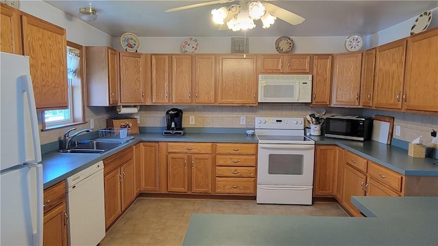 287 School Ave, Conemaugh Twp Som, PA 15937 - kitchen featuring white appliances, a ceiling fan, brown cabinetry, and backsplash